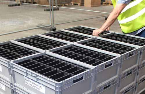 Returnable packaging containers