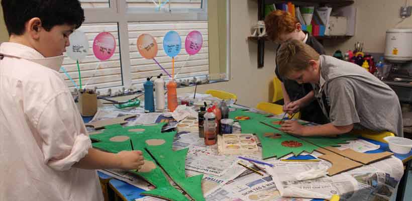 Children decorating trees