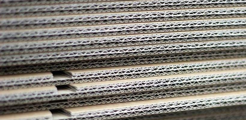 price-of-paper-affecting-cardboard A stack of corrugated cardboard material