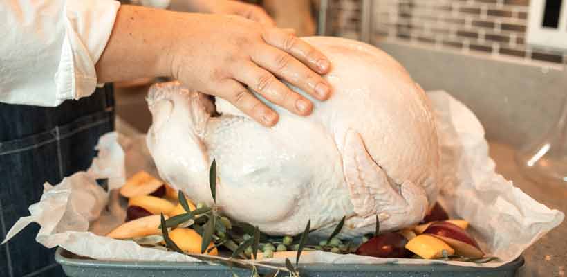 A turkey alongside Christmas food packaging