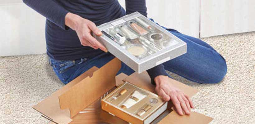 A female consumer enjoying an eCommerce unboxing experience