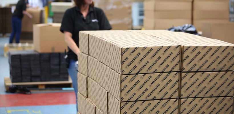Festive packaging being prepared in a warehouse.
