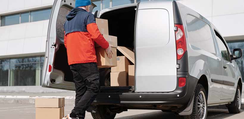 Festive packaging being loaded into a couriers van