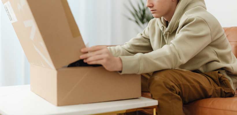 A person unboxing an eCommerce order