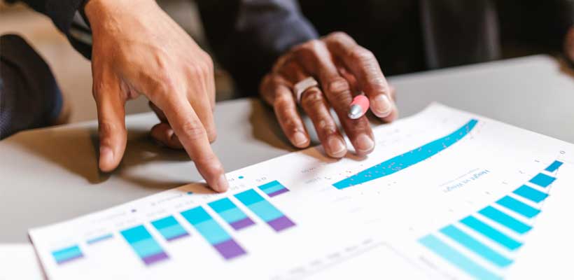 Office workers analysing charts