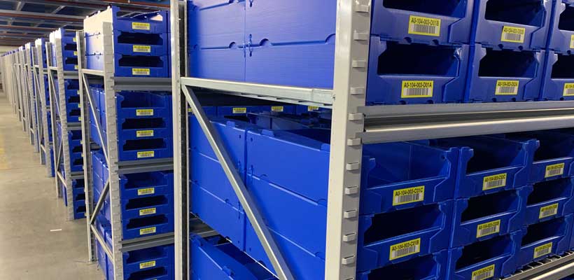A row of picking bins in a warehouse