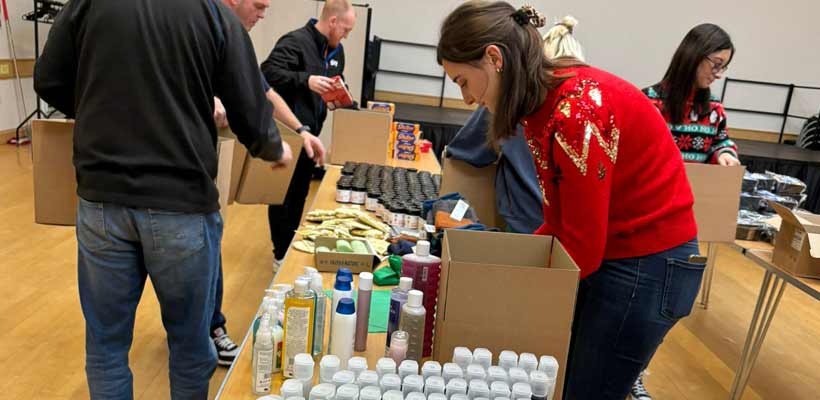 Marmalade Trust packaging Volunteers packing Christmas hampers