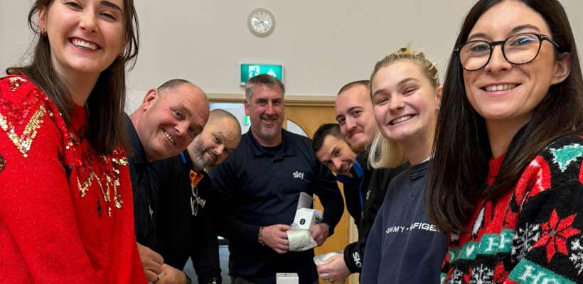 Marmalade Trust volunteers A group of men and women in Christmas jumpers