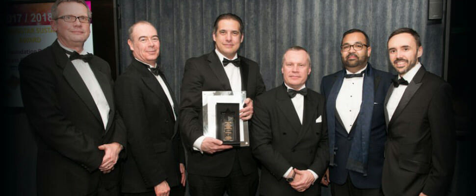 GWP team members receiving a Starpack Award at a black-tie event