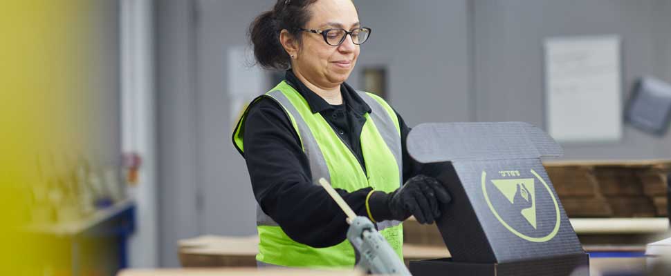 diversity Factory worker assembling packaging