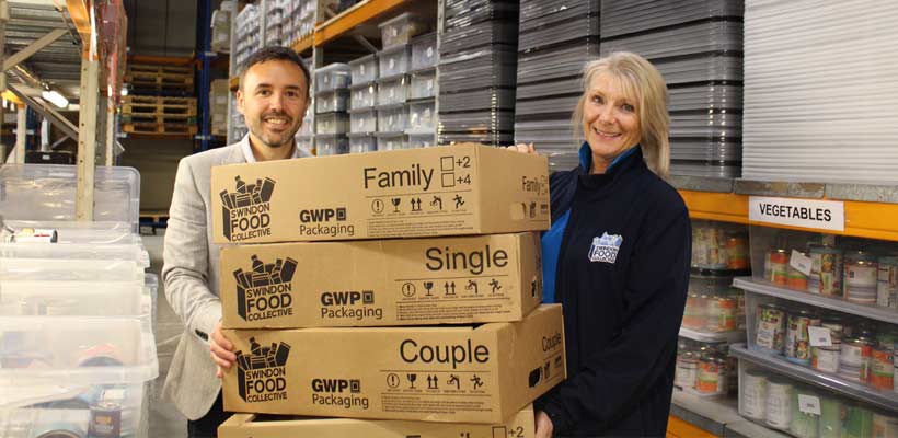 Swindon food collective packaging GWP Marketing Manager Matt Dobson, and Swindon Food Collective Manager Cher Smith MBE, with some of the donated boxes.