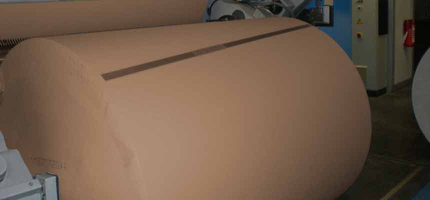 Recycled paper roll A large roll of recycled paper
