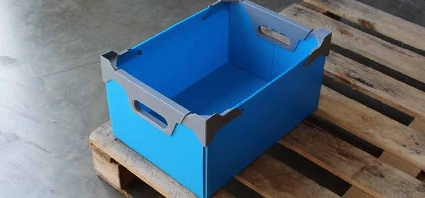 A reusable plastic tote on a pallet in a warehouse