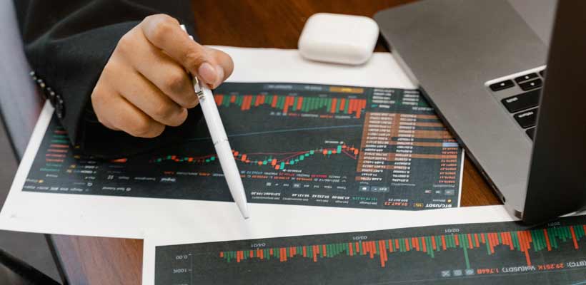 An office worker analysing data in graphs