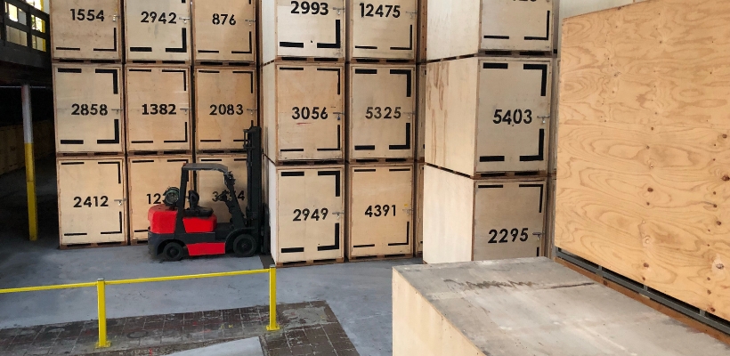 Labelled wooden crates Plywood crates labelled and being moved by a forklift