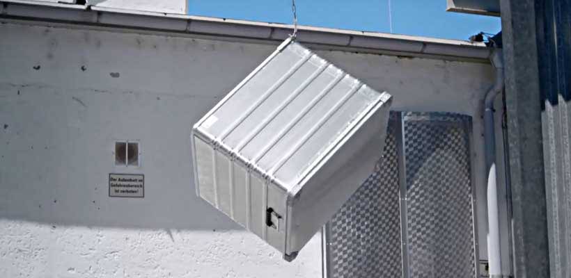 Drop testing defence standard-packaging An aluminium case falling through the air