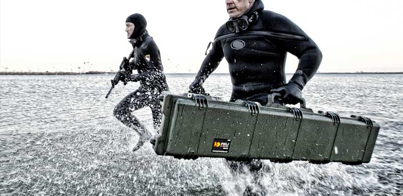 UN part number packaging Military personnel carrying equipment through shallow water.