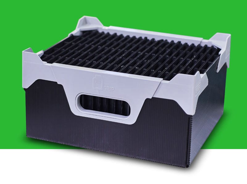 A black Correx tote container with divider sets inside