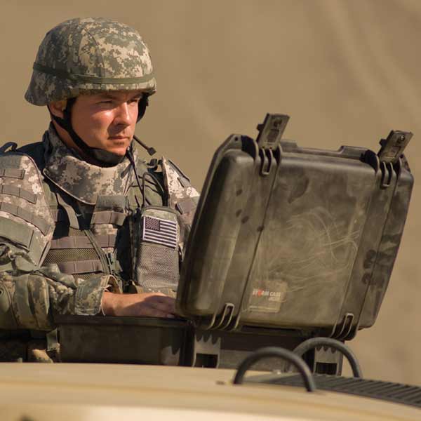 An army officer using military packaging in a desert environment