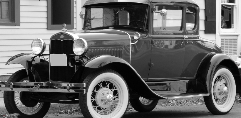 An old ford car in black and white