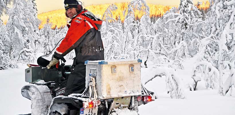 A Zarges case on a back of a snow-mobile