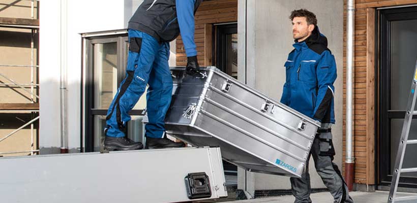 Zarges aluminium shipping cases Two people carrying a Zarges aluminium shipping case.