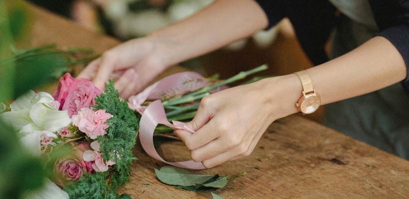 A florist packing some goods for dispatch