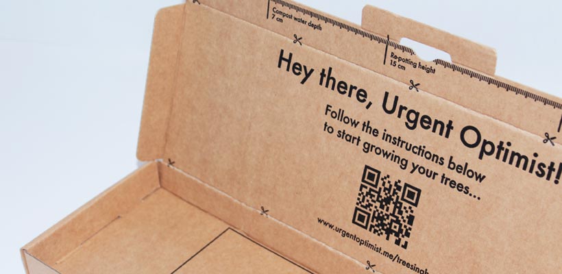 Subscription box style A brown cardboard subscription box with black printing.