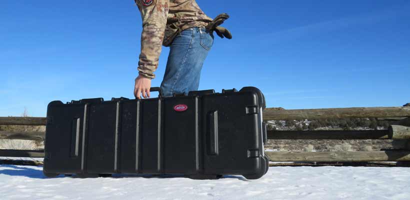 SKB case i series A person carrying a long SKB iSeries case