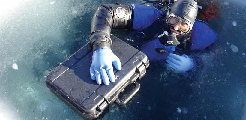 SKB case A diver emerging from ice with an SKB case
