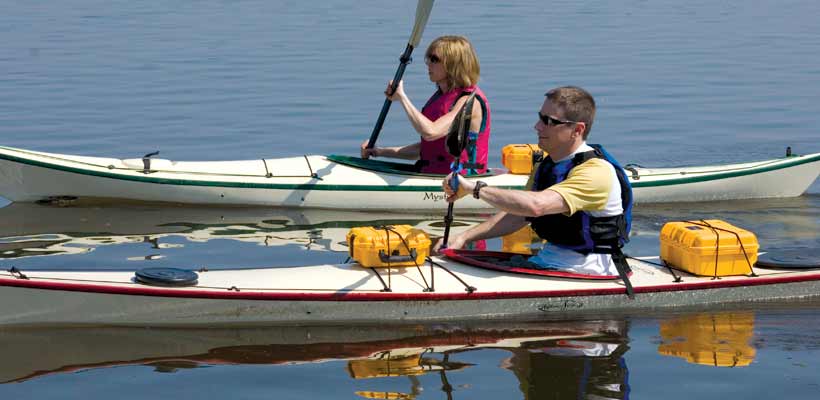 Waterproof Peli cases strapped to a canoe
