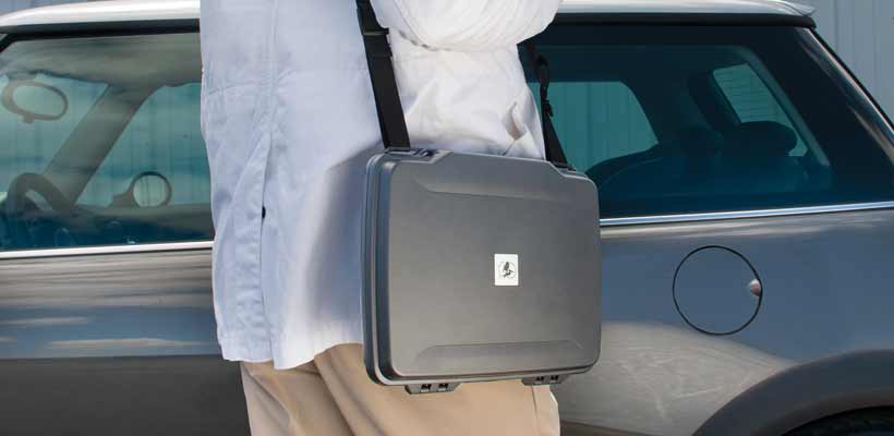 A person carrying a Peli hard laptop case
