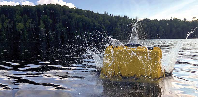 Waterproof case A Nanuk case being dropped into a lake