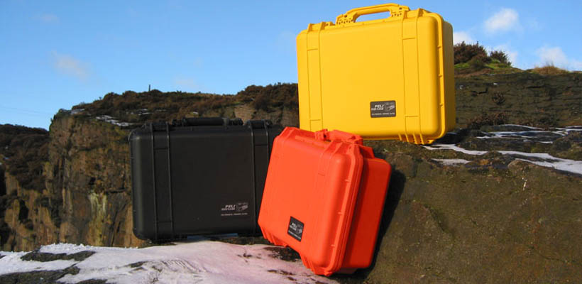 Peli case colours A collection of Pelican cases stacked on rocks