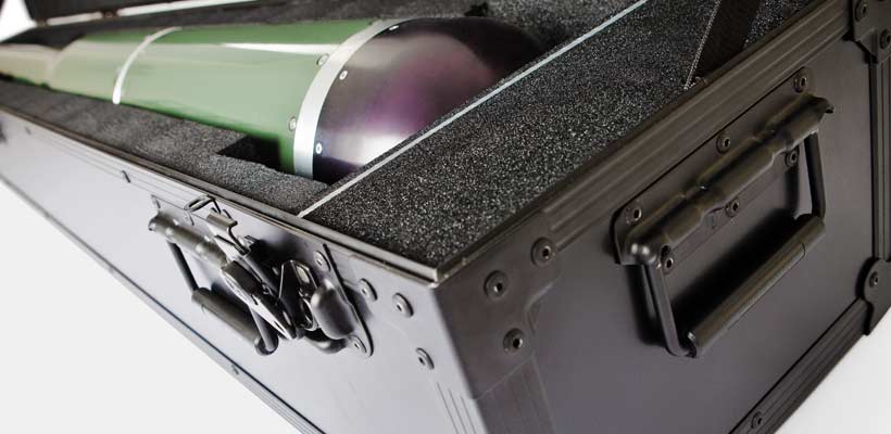 A custom flight case with foam containing a missile.