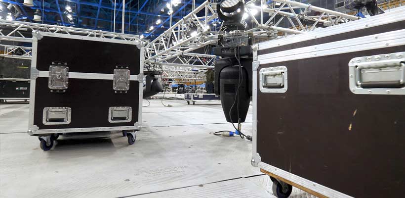 A collection of road cases during a concert setup